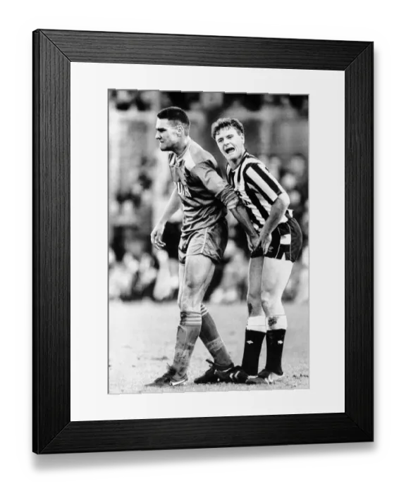 Framed Print : Wimbledons Vinnie Jones gets to grips with Newcastle United footballer Paul