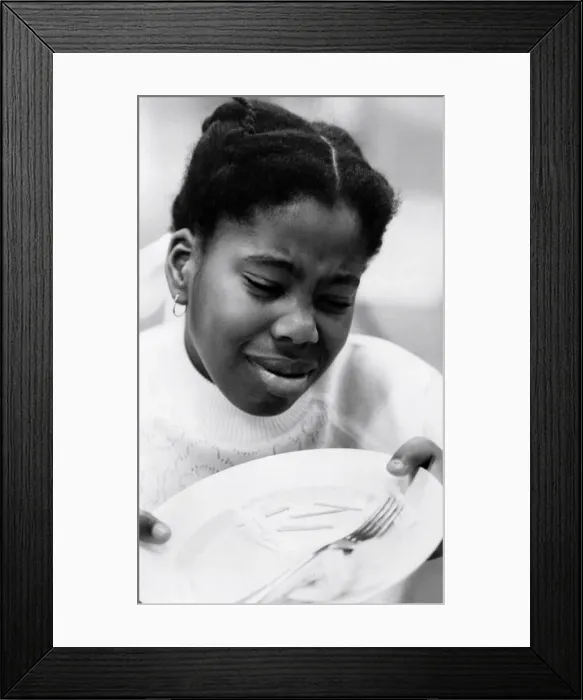 Framed Print : Children: Eating and Drinking: Fish finger tester Erica Loley. October 1980