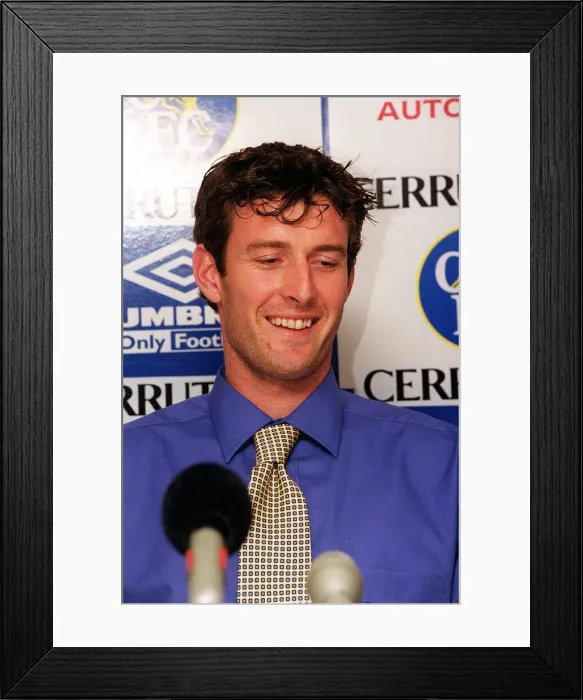 Framed Print : Chris Sutton, poses for the media during news press conference at Stamford Bridge after Framed Print : Chris Sutton, poses for the media during news press conference at Stamford Bridge after
