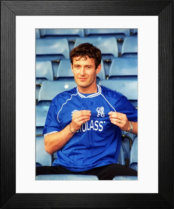 Framed Print : Chris Sutton, poses for the media during a photocall at Stamford Bridge after signing a Framed Print : Chris Sutton, poses for the media during a photocall at Stamford Bridge after signing a