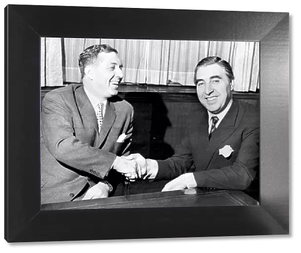Doug Ellis (left), new Aston Villa Chairman, pictured shaking hands with financier Pat