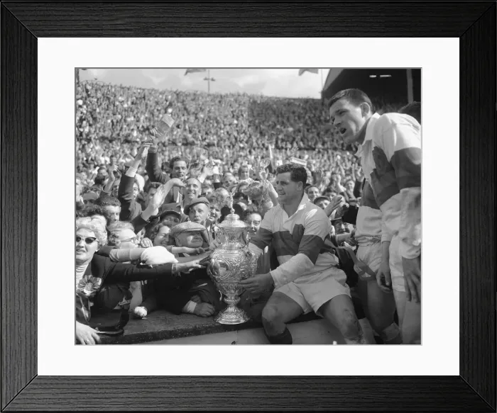 Framed Print : Derek Turner of Wakefield Trinity shows the trophy to fans after their 25 - 10 victory