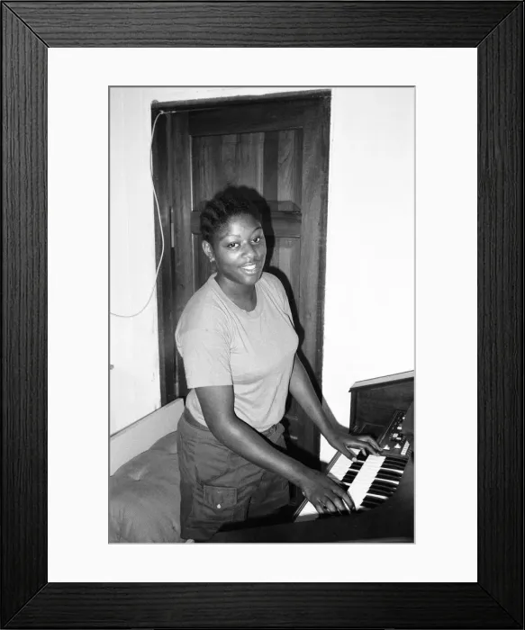 Framed Print : Student teacher plays the piano in Kingston, Jamaica, January 1984 Framed Print : Student teacher plays the piano in Kingston, Jamaica, January 1984