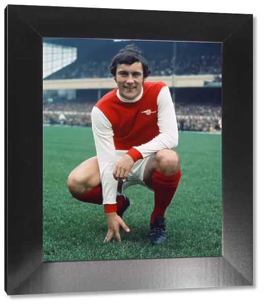 Arsenal footballer Ray Kennedy poses at Highbury before his side