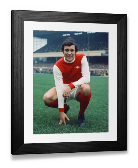 Framed Print : Arsenal footballer Ray Kennedy poses at Highbury before his side