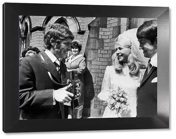 Everton footballer Alan Ball as photographer at the wedding of his teamate Howard Kendall