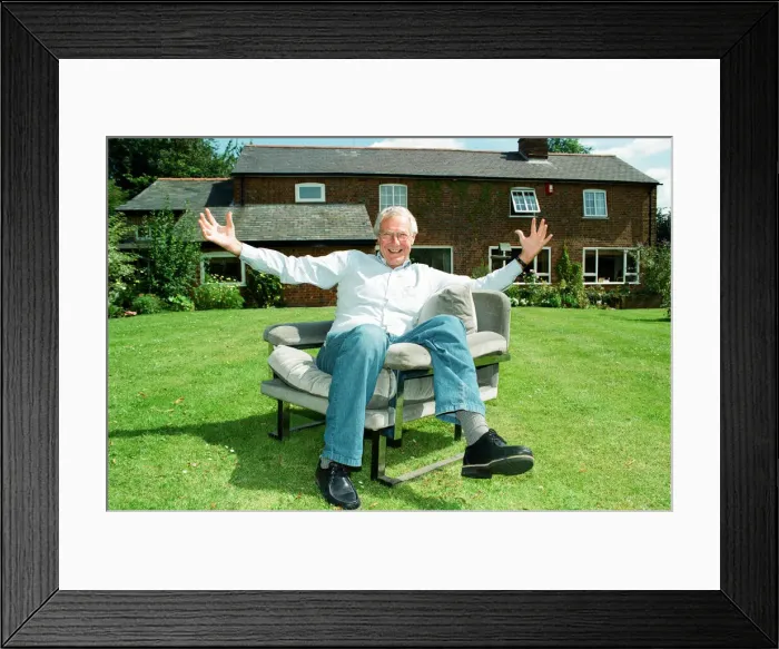 Framed Print : Barry Norman Film Critic seen here in the garden of his Datchworth home with the chair he Framed Print : Barry Norman Film Critic seen here in the garden of his Datchworth home with the chair he