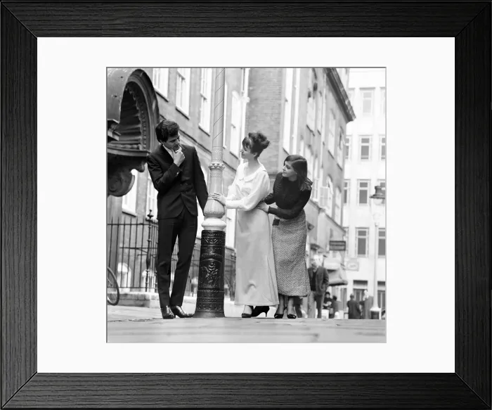 Framed Print : Eden Kane, British pop singer, pictured with two models showing off the lastest ankle