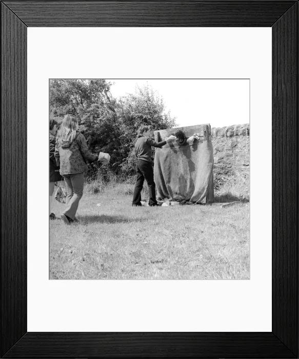 Framed Print : The residents of the West End of Newcastle playing old English games at the Denton Burn Framed Print : The residents of the West End of Newcastle playing old English games at the Denton Burn