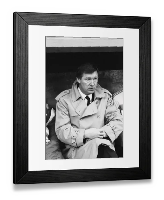 Framed Print : Manchester United manager Alex Ferguson checks his watch in the dugout during the League Framed Print : Manchester United manager Alex Ferguson checks his watch in the dugout during the League