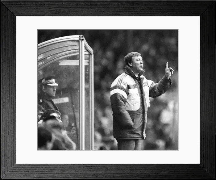 Framed Print : Manchester United manager Alex Ferguson shouts instructions from the dugout during his
