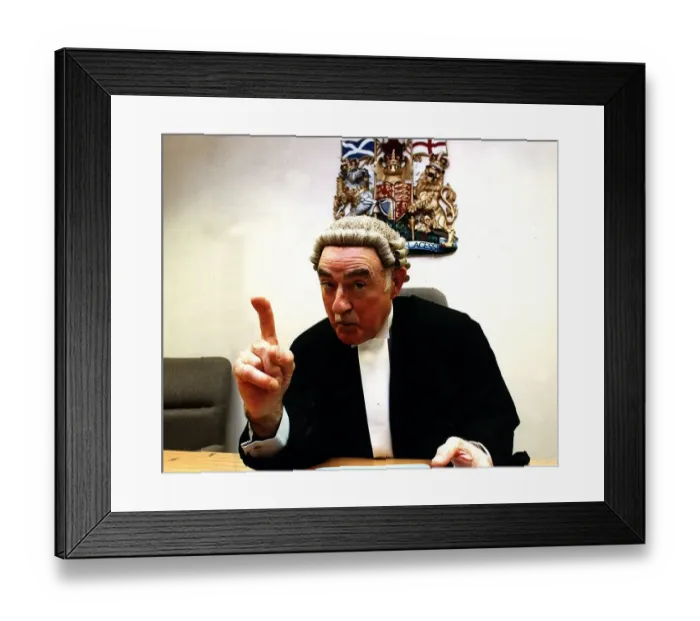 Framed Print : Sheriff J. Irvine Smith, poses pointing his finger wearing wig and gown Framed Print : Sheriff J. Irvine Smith, poses pointing his finger wearing wig and gown