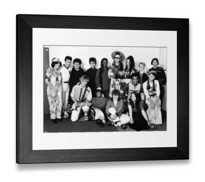 Framed Print : Boy George and his group Culture Club with pose with female fans