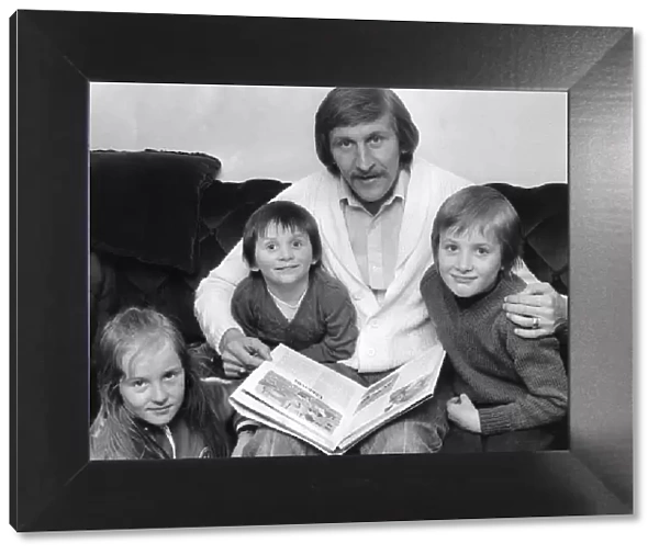 Tommy Hutchison relaxes at home with his children Lynn (9), David (3) and John (6)
