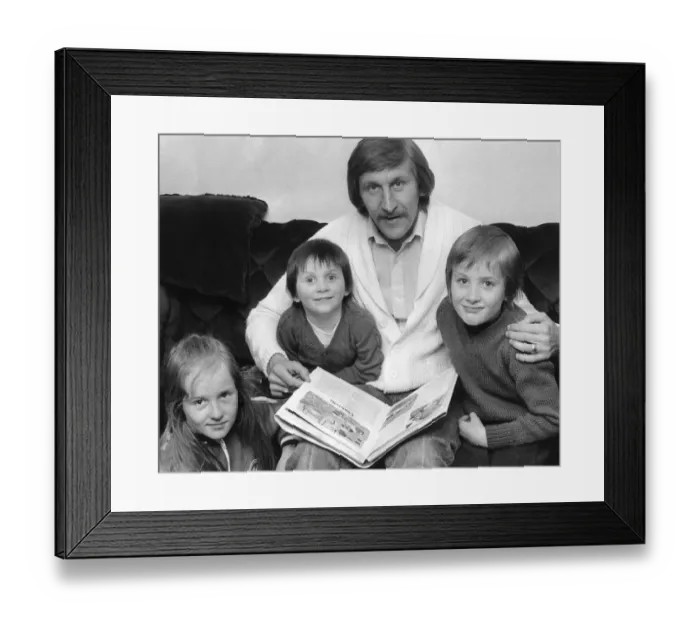 Framed Print : Tommy Hutchison relaxes at home with his children Lynn (9), David (3) and John (6)