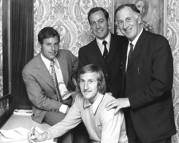 Tommy Hutchison signs for Coventry City in his bedroom at the Hotel Leofric on his