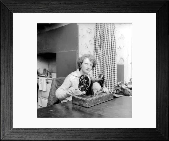 Framed Print : Woman using sewing machine. Circa 1964 A1137b-002 Framed Print : Woman using sewing machine. Circa 1964 A1137b-002
