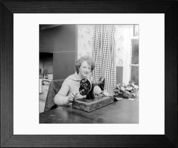 Framed Print : Woman using sewing machine. Circa 1964 A1137b-002 Framed Print : Woman using sewing machine. Circa 1964 A1137b-002