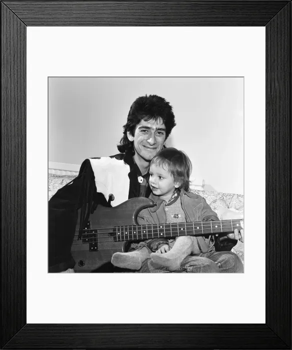 Framed Print : Gary Holton, Actor and son Red, pictured together at home in London, December 1984 Framed Print : Gary Holton, Actor and son Red, pictured together at home in London, December 1984