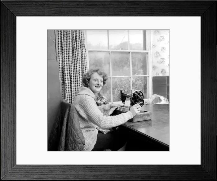 Framed Print : Woman using sewing machine. Circa 1964 A1137b-002 Framed Print : Woman using sewing machine. Circa 1964 A1137b-002