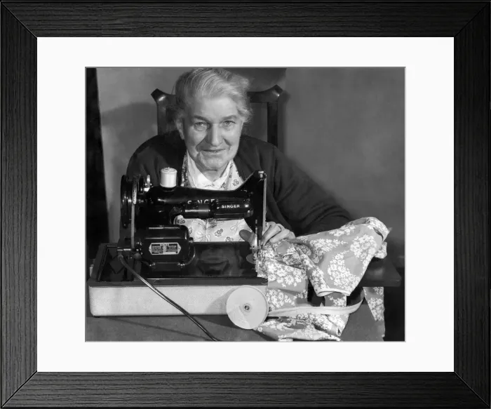 Framed Print : A very happy Mrs. Emms with her new Singer Sewing machine presented to her by the Daily