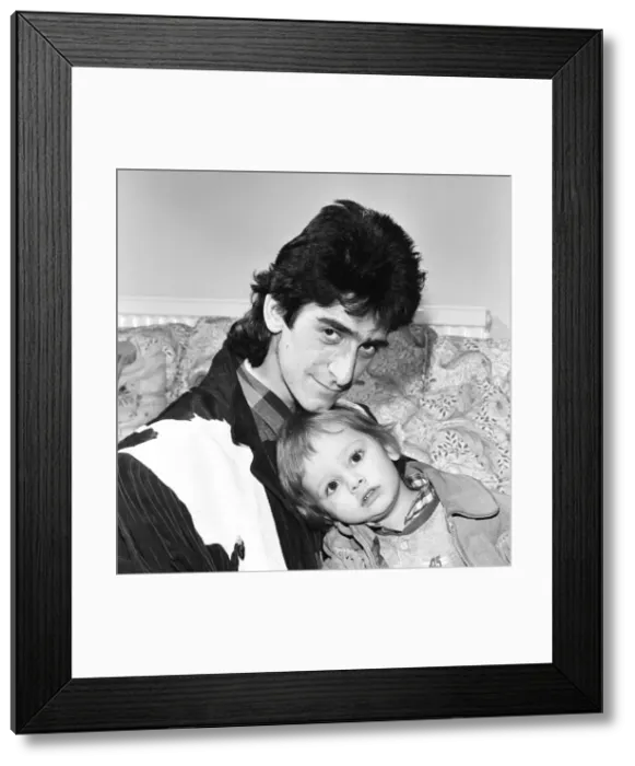 Framed Print : Gary Holton, Actor and son Red, pictured together at home in London, December 1984 Framed Print : Gary Holton, Actor and son Red, pictured together at home in London, December 1984