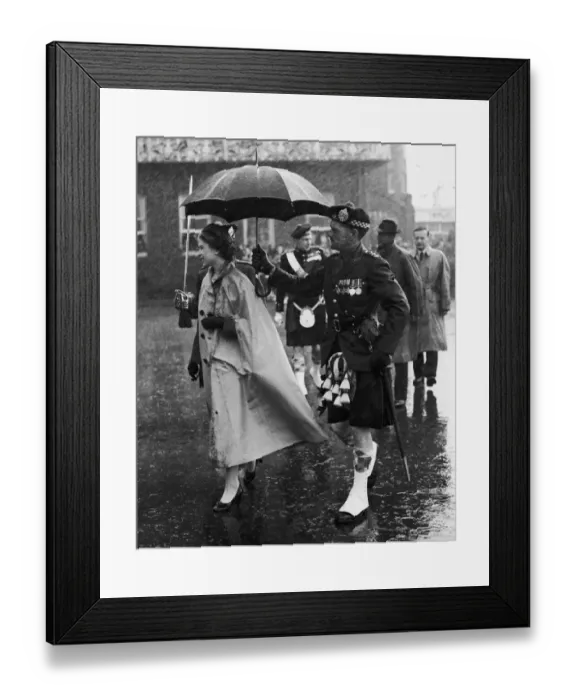 Framed Print : Royal Tour of the Isles. The Queen is drenched as she steps ashore at Oban Framed Print : Royal Tour of the Isles. The Queen is drenched as she steps ashore at Oban