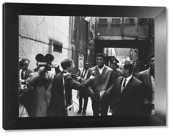 Cassius Clay (Muhammad Ali) seen here being interviewed by a BBC camera crew during a