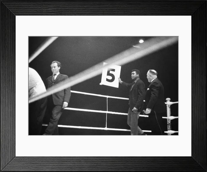 Framed Print : Cassisus Clay (Muhammad Ali) seen here holding the 5th round card during the fight Framed Print : Cassisus Clay (Muhammad Ali) seen here holding the 5th round card during the fight