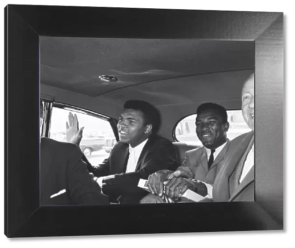 Cassius Clay left with his brother Rudoph and Jack Solomons seen here in a Rolls Royce