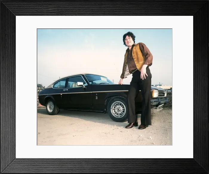 Framed Print : Former Rangers football player Jim Baxter poses besides his Ford Capri, circa 1980