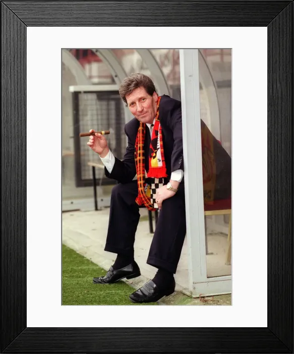 Framed Print : Partick Thistle football manager John Lambie smoking a cigar as he sits in the dugout Framed Print : Partick Thistle football manager John Lambie smoking a cigar as he sits in the dugout