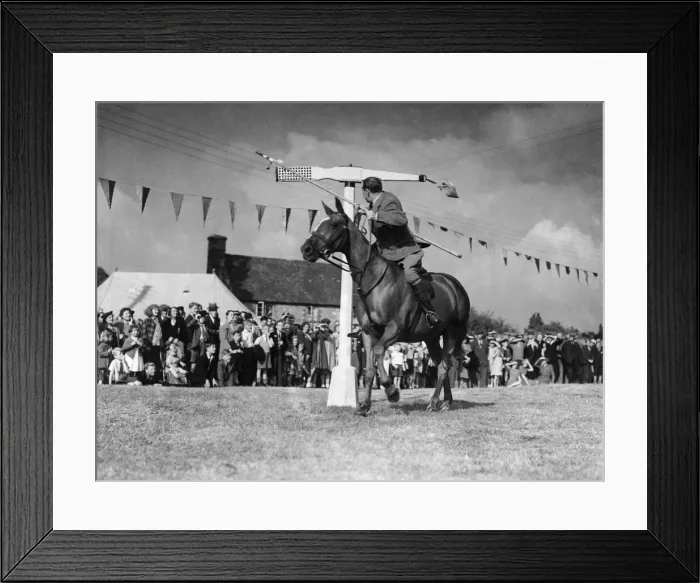 Framed Print : The old sport of tilting at the quintain, one popular throughout medieval England Framed Print : The old sport of tilting at the quintain, one popular throughout medieval England