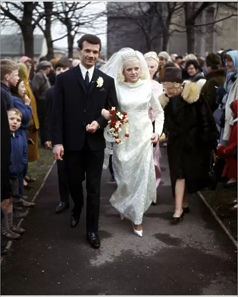 Leeds United footballer Paul Reaney with bride Sandra Proctor after their wedding