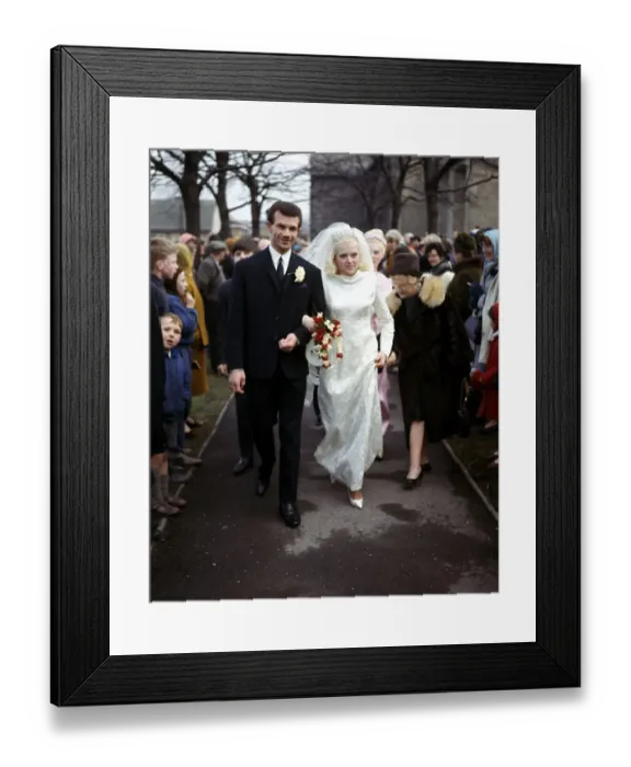 Framed Print : Leeds United footballer Paul Reaney with bride Sandra Proctor after their wedding