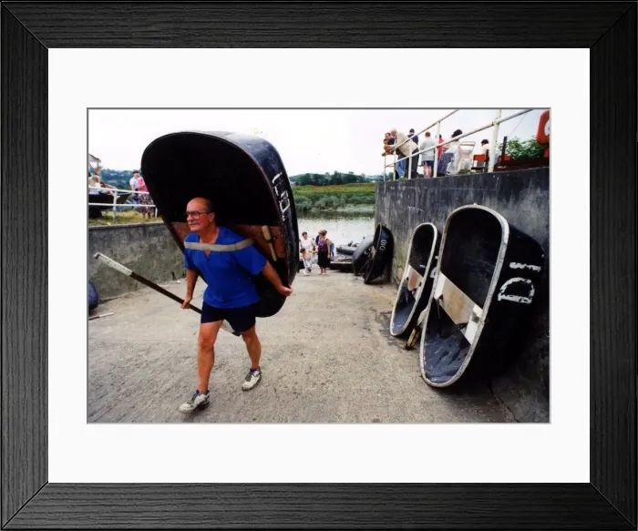 Framed Print : Coracle racing - The tradition of coracle racing returned to the Tywi at the weekend - as