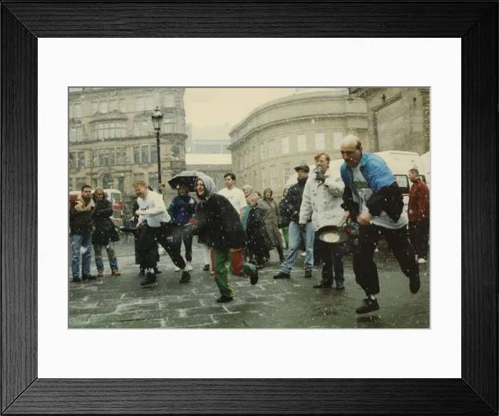 Framed Print : Competitors strugging through snow and sleet to take part in the Shrove Tuesday Pancake Framed Print : Competitors strugging through snow and sleet to take part in the Shrove Tuesday Pancake