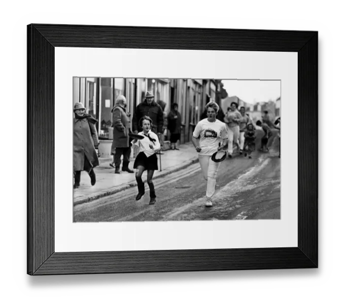Framed Print : Competitors take part in the Alnwick Shrove Tuesday Pancake race 16 February 1988 Framed Print : Competitors take part in the Alnwick Shrove Tuesday Pancake race 16 February 1988