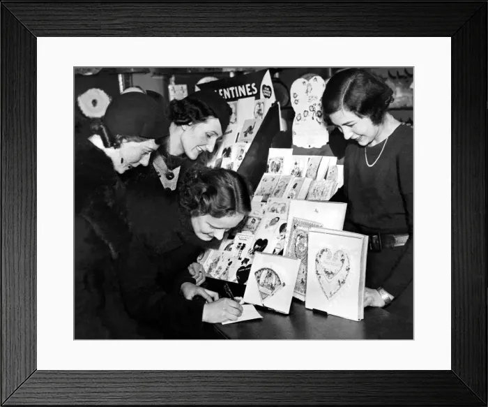 Framed Print : Three young ladies decide which cards to choose for their loved one on St Valentine