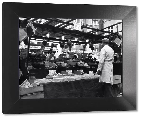 Greengrocers stall in East Street Market, London. circa 1965
