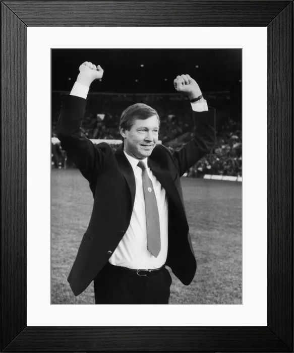 Framed Print : New Manchester United manager Alex Ferguson waves to the Old Trafford crowd before