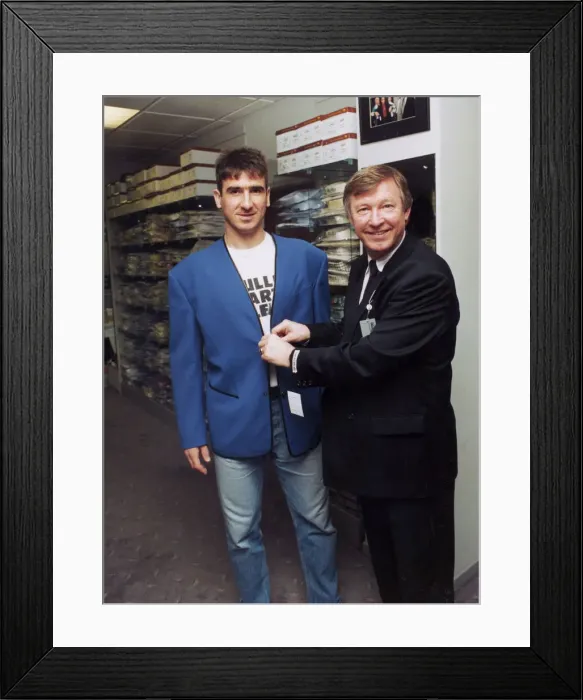 Framed Print : Manchester United manager Alex Ferguson with Eric Cantona in a clothes shop Framed Print : Manchester United manager Alex Ferguson with Eric Cantona in a clothes shop
