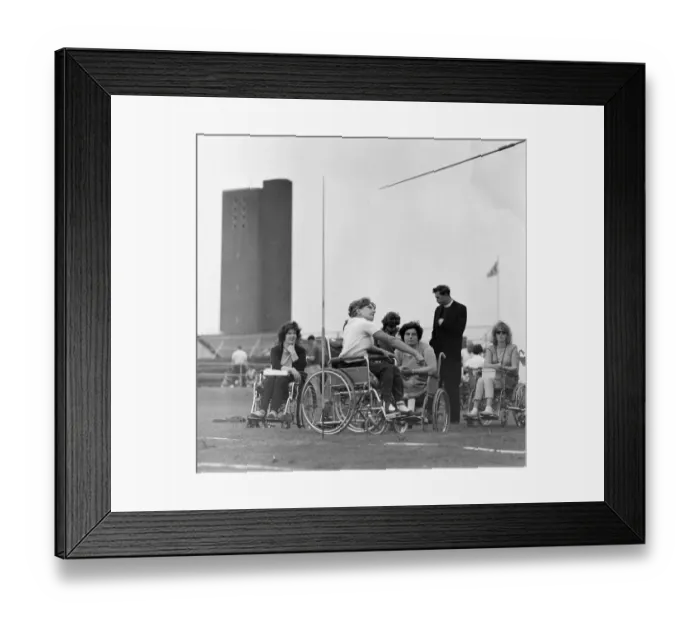 Framed Print : Paralympic Athletes training at Stoke Mandeville, watched by patients