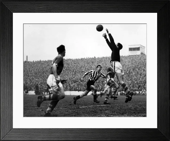 Framed Print : collect a high ball as Newcastle Uniteds Curry dashes in to challenge- 6th March