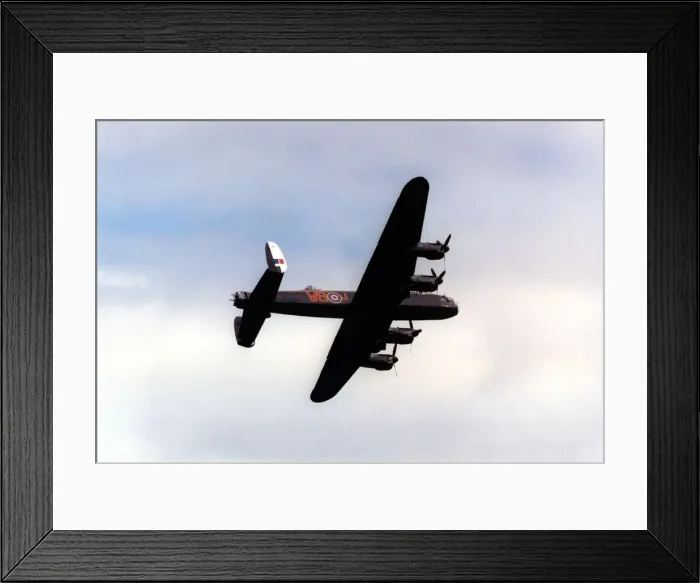 Framed Print : An Avro Lancaster bomber aircraft of the Battle of Britain Memorial Flight flies past Framed Print : An Avro Lancaster bomber aircraft of the Battle of Britain Memorial Flight flies past