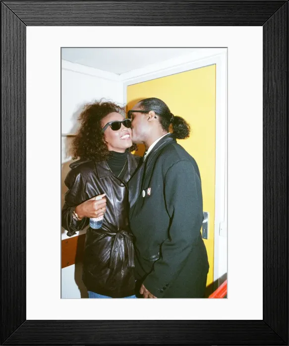 Framed Print : Stevie Wonder kisses Whitney Houston on the cheek as they laugh backstage at the Nelson Framed Print : Stevie Wonder kisses Whitney Houston on the cheek as they laugh backstage at the Nelson