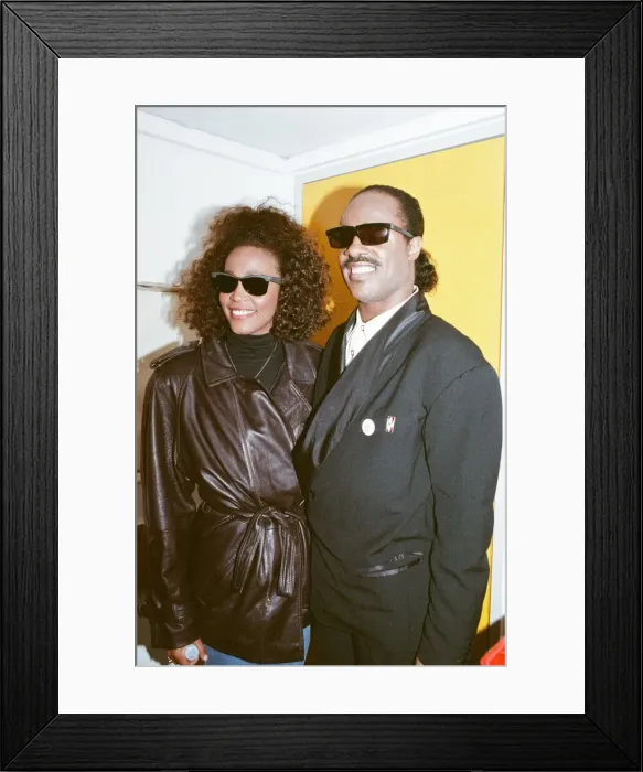 Framed Print : Whitney Houston and Stevie Wonder smile for a photograph backstage at the Nelson Mandela Framed Print : Whitney Houston and Stevie Wonder smile for a photograph backstage at the Nelson Mandela