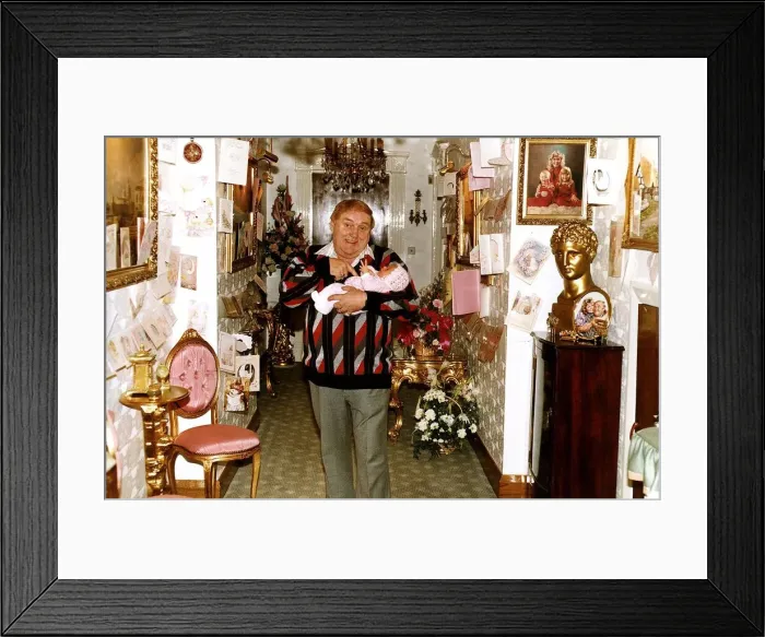 Framed Print : Les Dawson comedian with his baby daughter Charlotte at home A©Mirrorpix