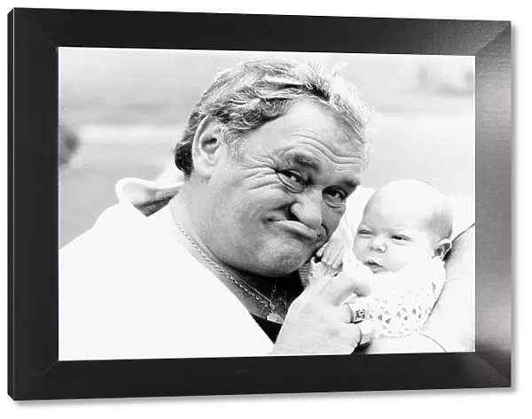 Comedian Les Dawson with baby Alexander Rigby 1987