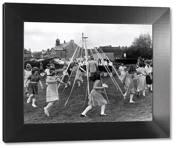 Children dancing around the maypole on the site of the car park, Cowbridge. 5th May 1981